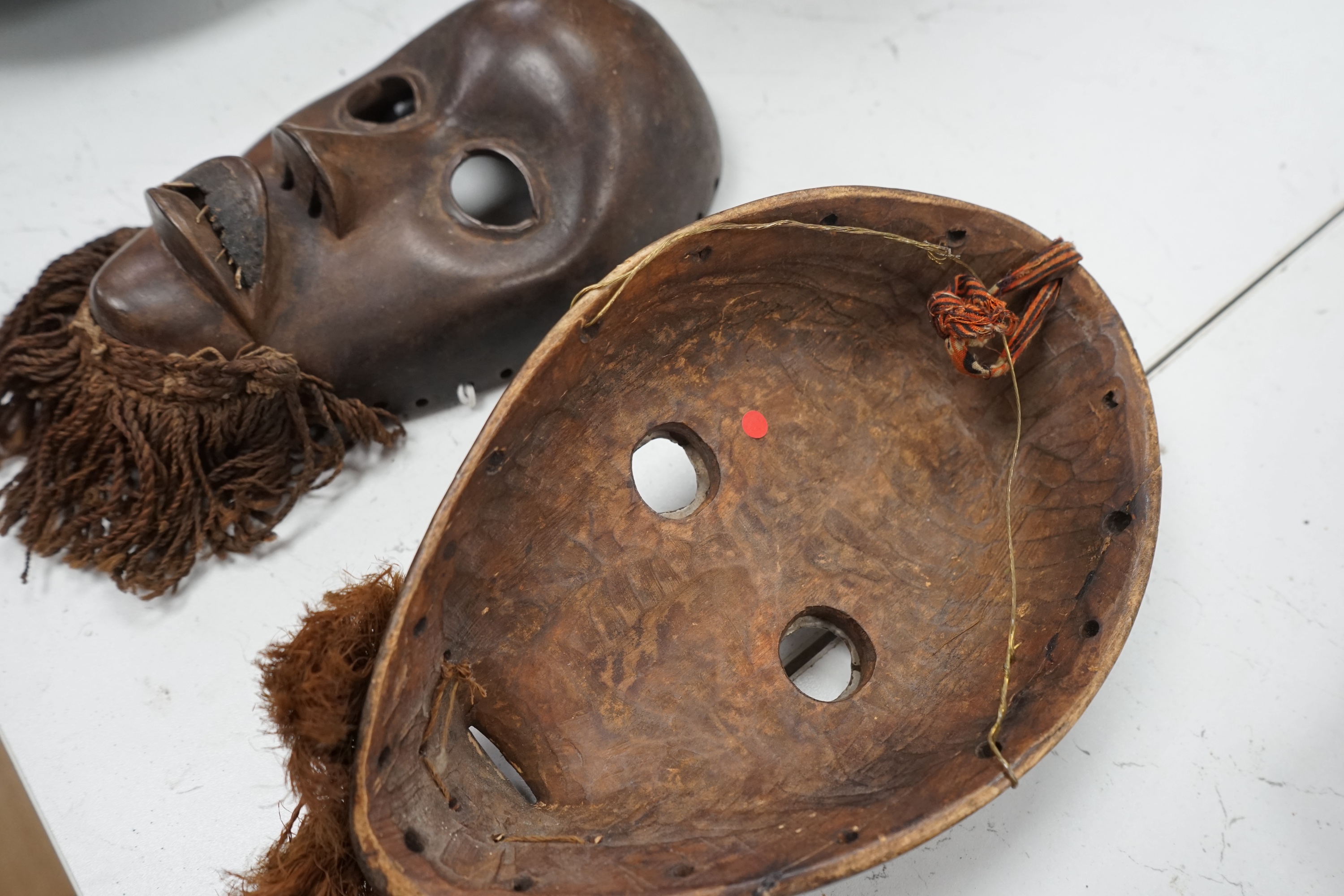 Two African Ivory Coast/Liberian Dan masks, 23cm high. Condition - fair